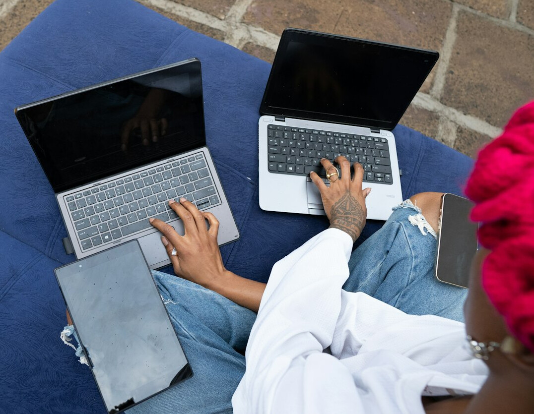 kids coding on laptops