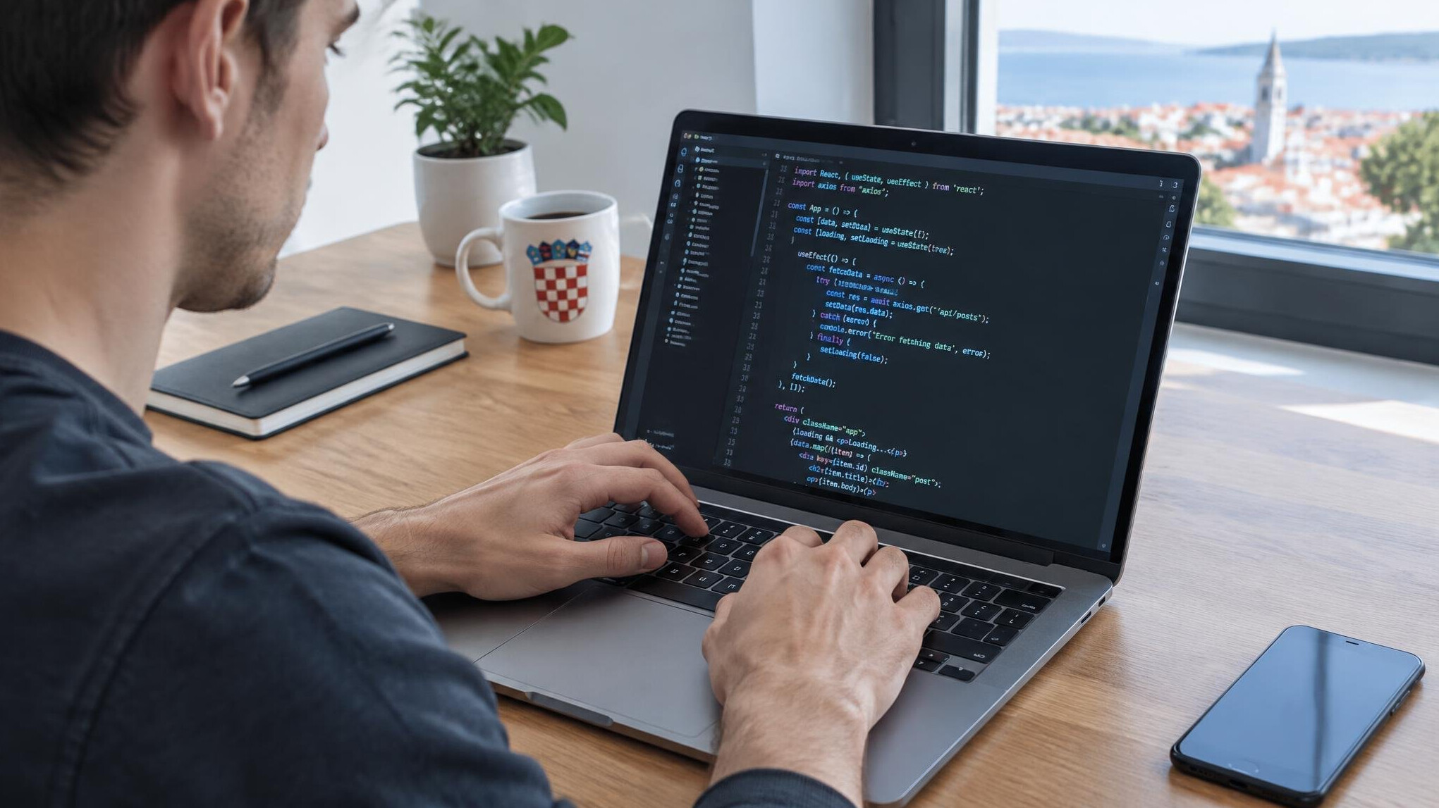 Person typing code on a laptop with lines of programming syntax on screen